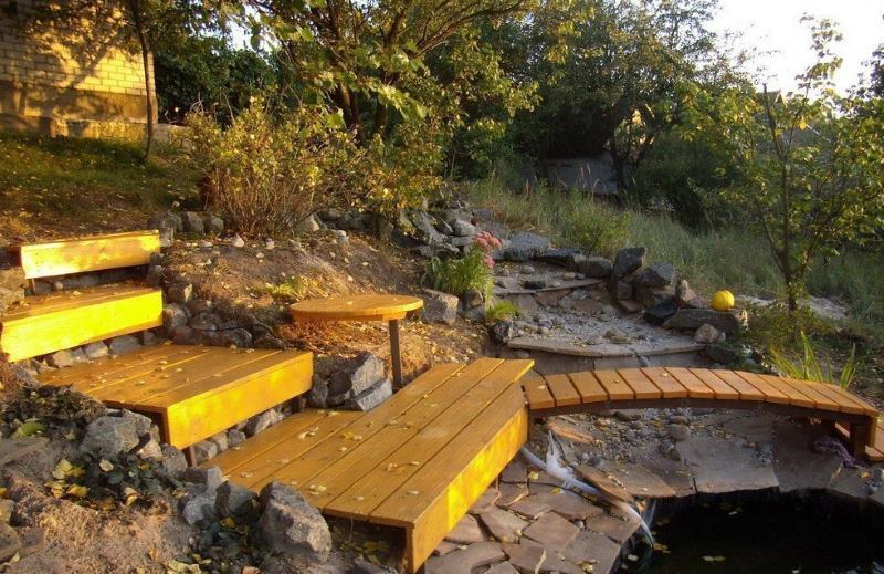 Wooden steps of a garden staircase leading down a site