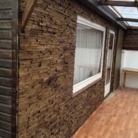 Wood trim on the exterior wall of a residential building