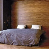 Bedroom with wall decoration with wooden decorative panels