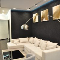 Black walls and white sofa in odnushka panel house