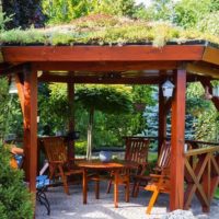 Wooden arbor with grass on the roof