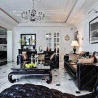 Black furniture in a white living room