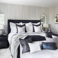 Striped wallpaper in the bedroom interior