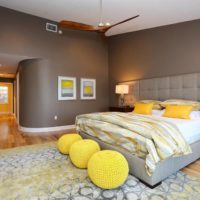 Spherical ottomans in the bedroom interior