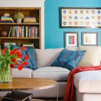 Books in a niche over a sofa in the living room