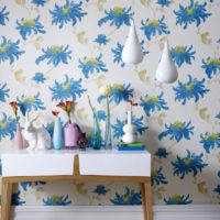 Wallpaper in the living room with bright blue ornaments