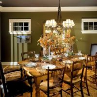 Table setting in a room with olive walls.