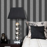 Striped wall behind the head of the bed