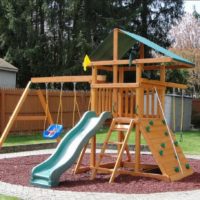 Slide with swings on the playground of a summer cottage