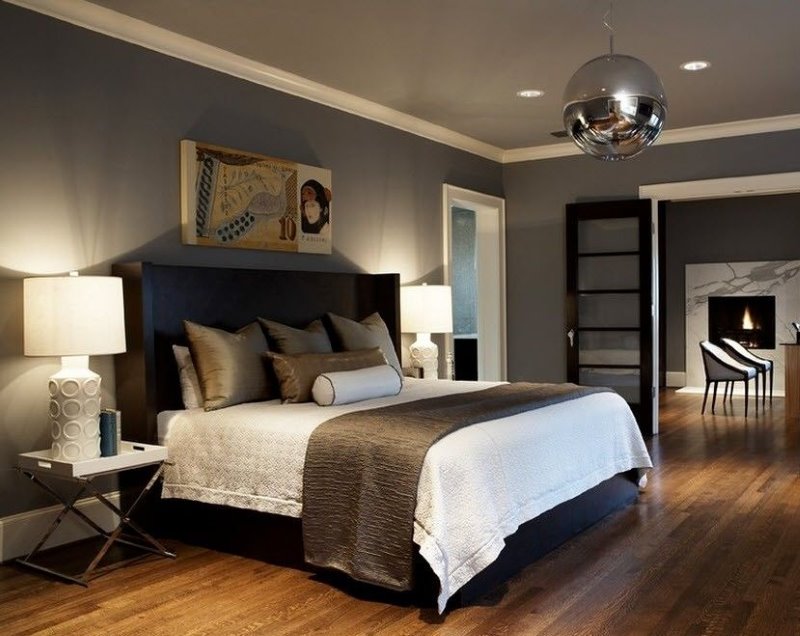 Large bed in the men's bedroom in dark colors