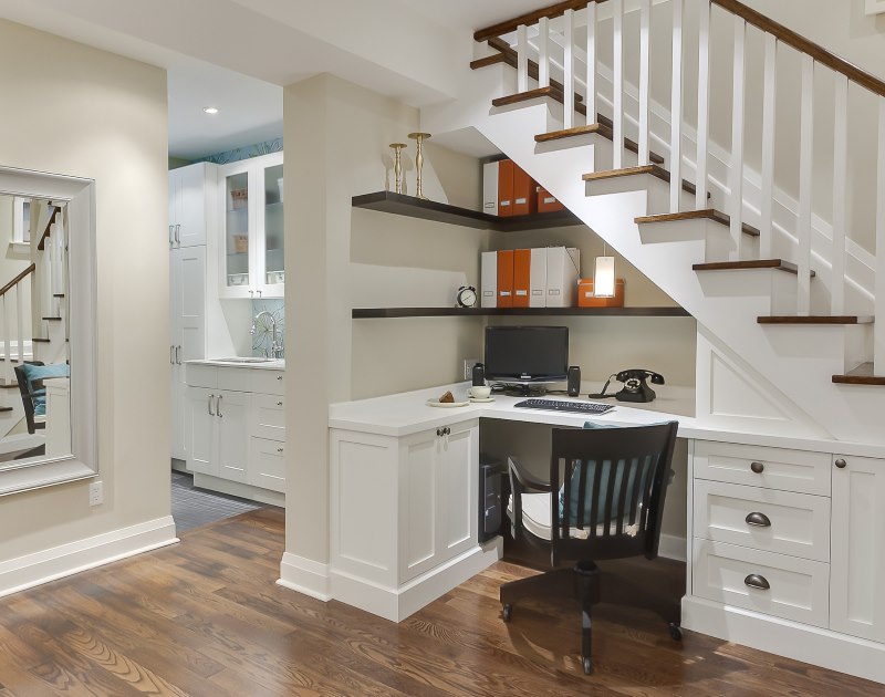 study under the stairs in the living room of a private house