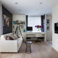 Living room in a city apartment with a brick wall