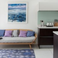 Wooden daybed in the living room of a country house