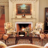 Stucco molding over a fireplace in the living room of a country house