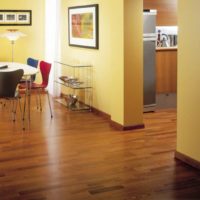 Yellow walls in the living room with brown floor