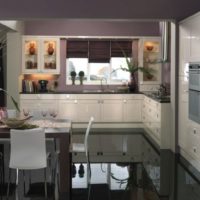 Black glossy floor in the kitchen-living room