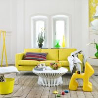 Yellow furniture against the white walls of the living room