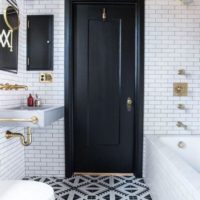 Black door in a modern bathroom