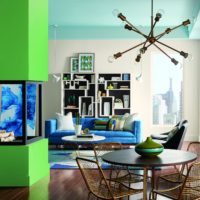 Green fireplace facade in the living room of a country house