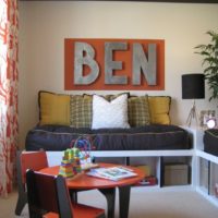 Wall with letters over the sofa in the nursery