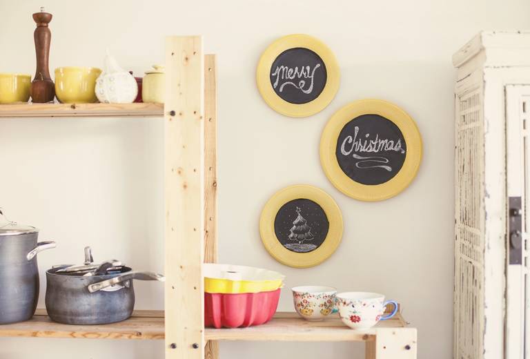 Wooden shelves for dishes in the interior of the kitchen