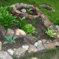 A stone flower bed in a garden