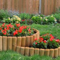 Wooden flowerbed in the design of the garden