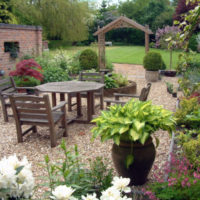 Wooden furniture on a gravel site