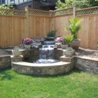 A small waterfall in the corner of a summer cottage