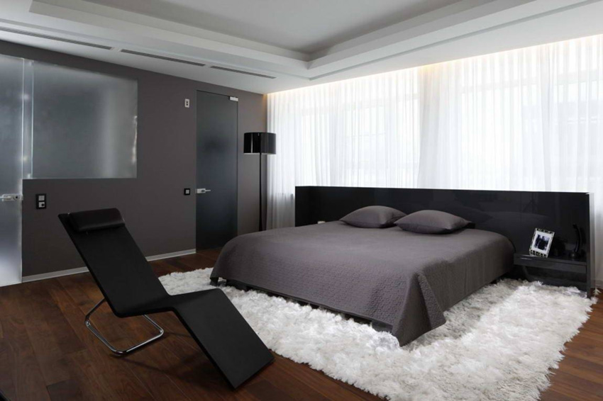 Chambre avec mobilier high-tech sombre