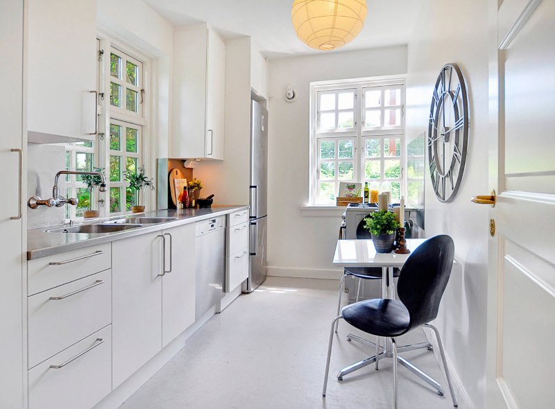 White kitchen with light linoleum on the floor