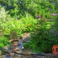 Decoration of a country garden with flowerpots