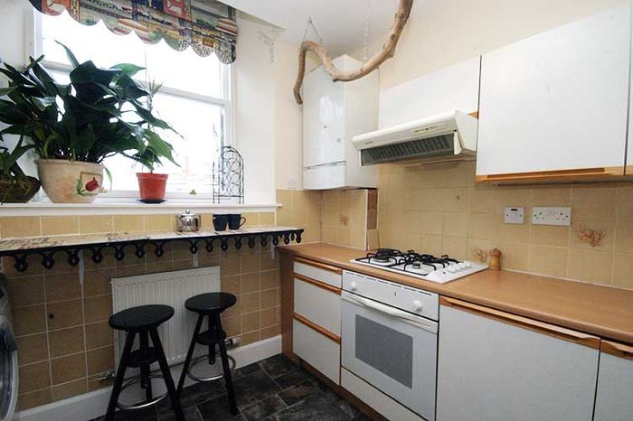 Gas boiler in a corner in a small kitchen