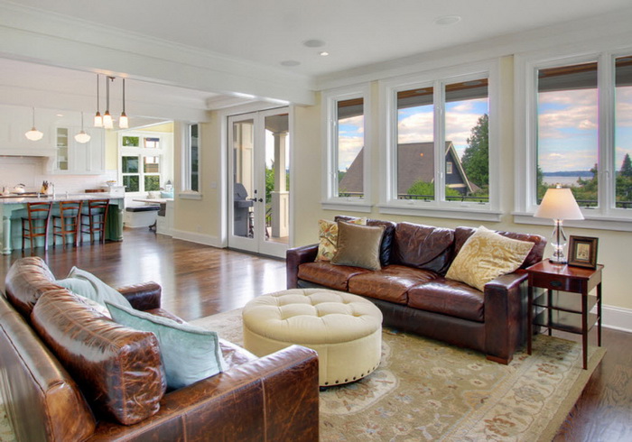 Two brown sofas in a room with a white ceiling