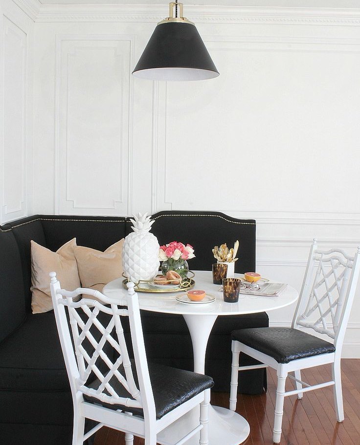 The interior of the dining area with black furniture