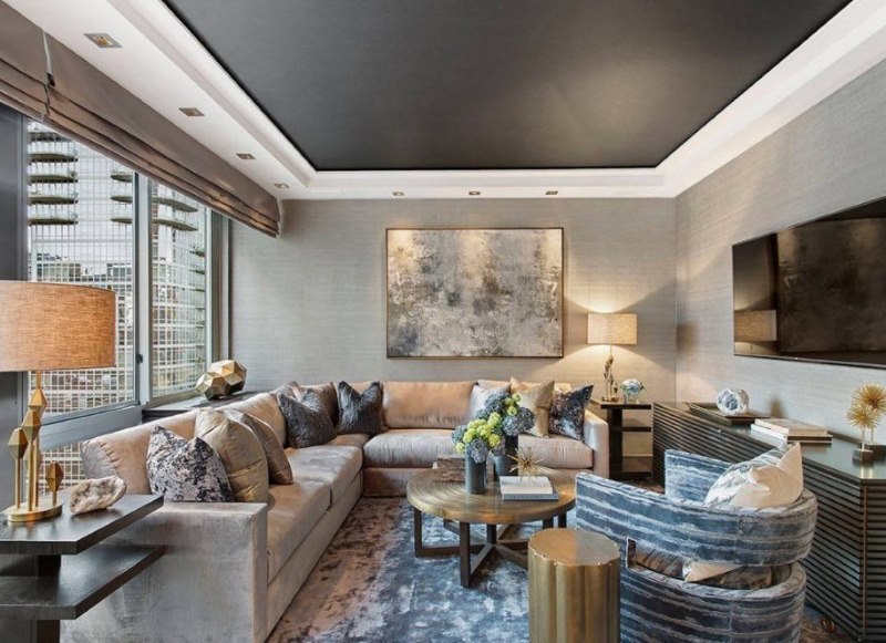 Black stretch ceiling in the design of the hall of a city apartment