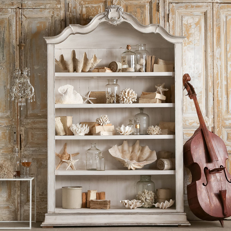 Nautical decorations on the shelves of the kitchen sideboard