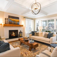 Chandelier with open lamps in the interior of the living room of a private house