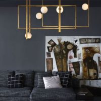 Gray living room interior with minimalist chandelier.