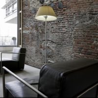 Black armchair and brickwork