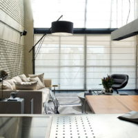 Living room with panoramic windows in a country house