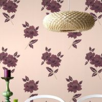 Original lamp on the background of paper wallpaper