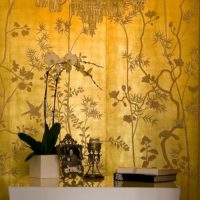 Golden wallpaper with floral ornaments