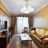 Chandelier in a room with dark walls.