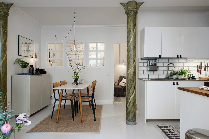 Scandinavian-style kitchen-living room interior with marble column