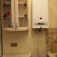 Cabinet with glass doors next to the gas boiler