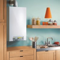 Automatic gas boiler on a blue wall