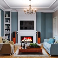 Colorful sofas in the living room interior with fireplace