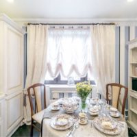 Dining table setting in a small kitchen of a private house