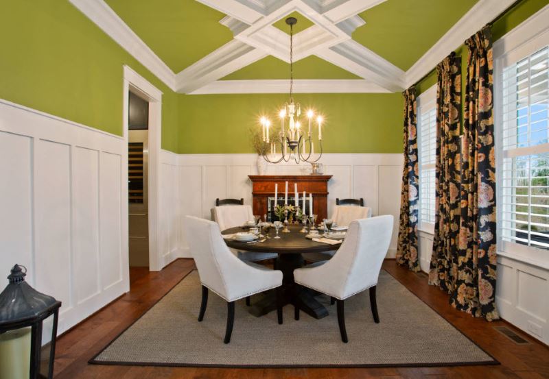 Living room interior with chandelier on a green ceiling